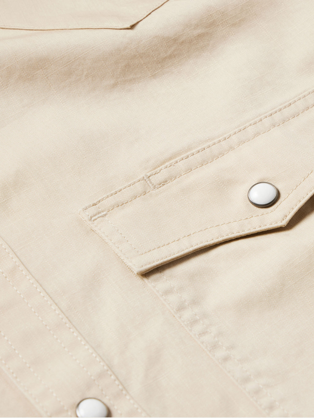 Khaki slub twill shirt cuff with snap closure and contrast stitching