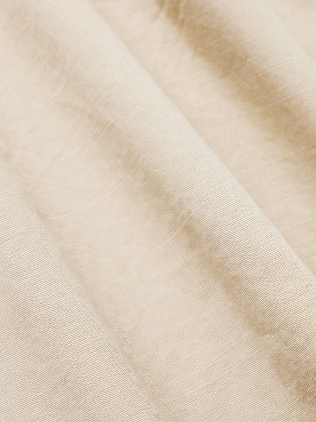 Light beige slub twill shirt fabric close-up