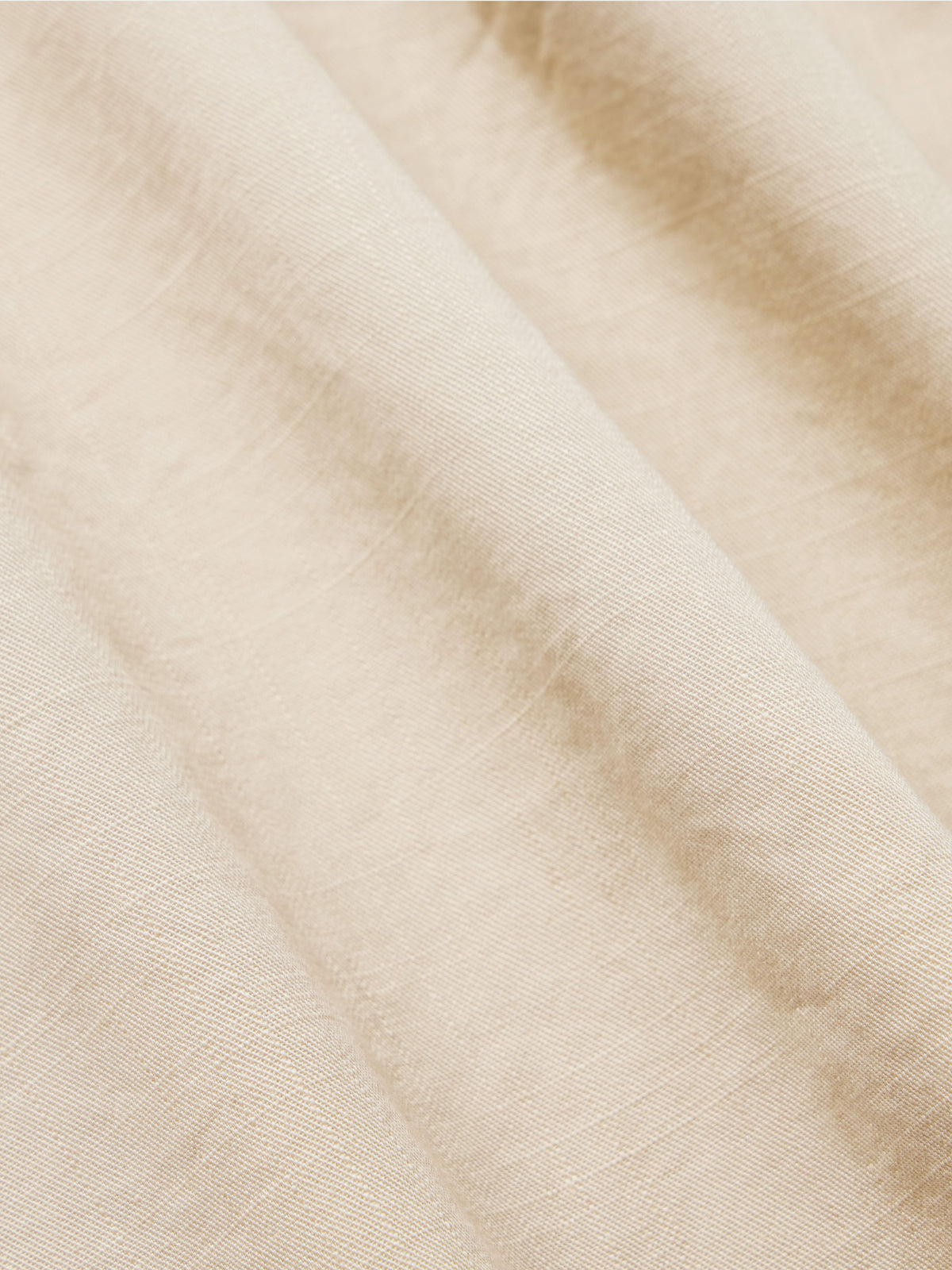 Light beige slub twill shirt fabric close-up