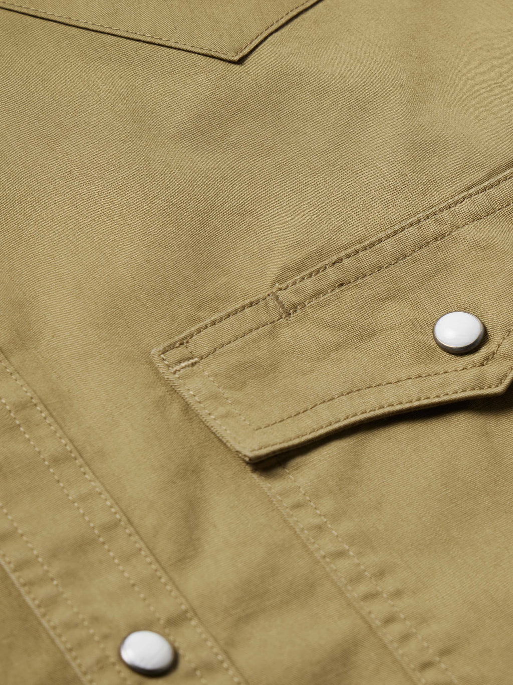 Olive slub twill shirt with snap cuff and visible stitched seam details
