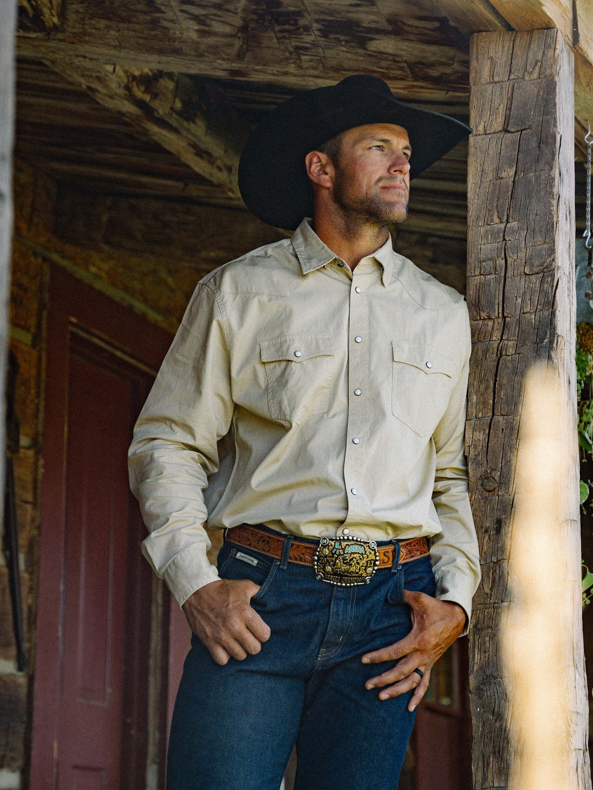 Light cream western-style button-up shirt with snap cuffs and chest pockets