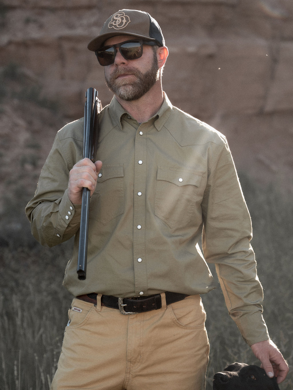 Olive slub twill snap shirt worn with cap and glasses