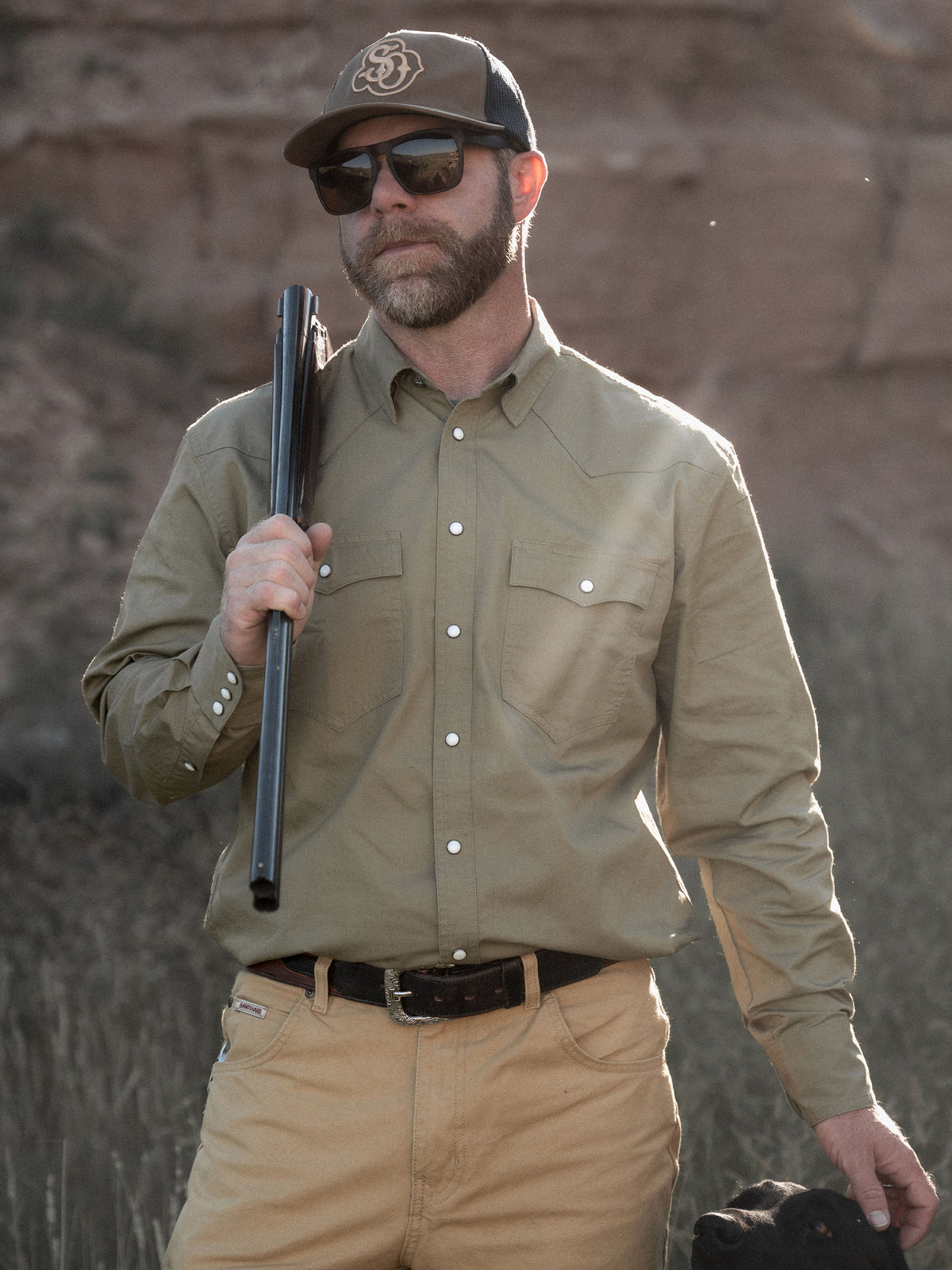 Olive slub twill snap shirt worn with cap and glasses