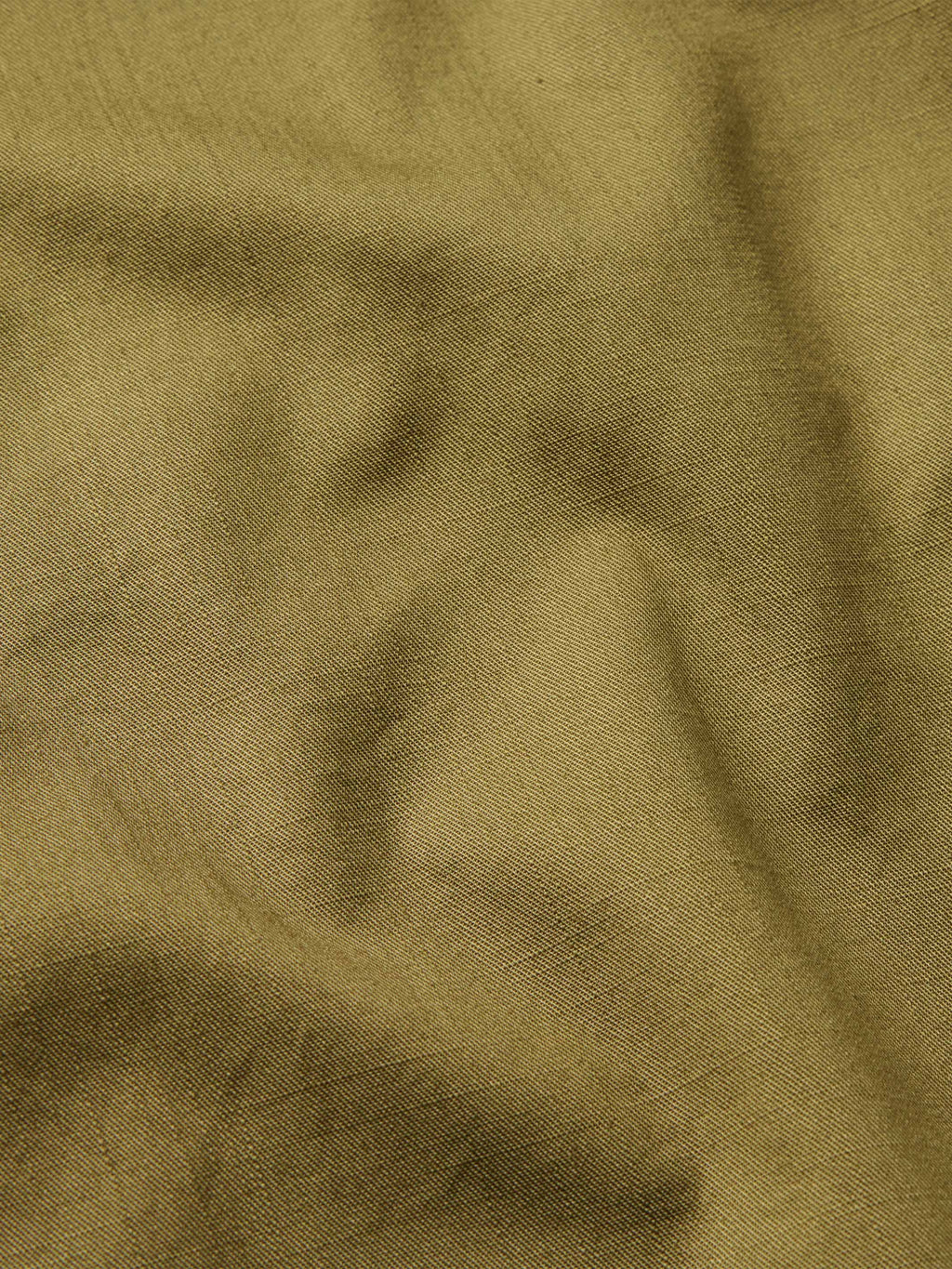Olive slub twill fabric close-up with subtle slub texture
