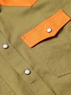 Olive shirt sleeve with orange tab and white snap buttons
