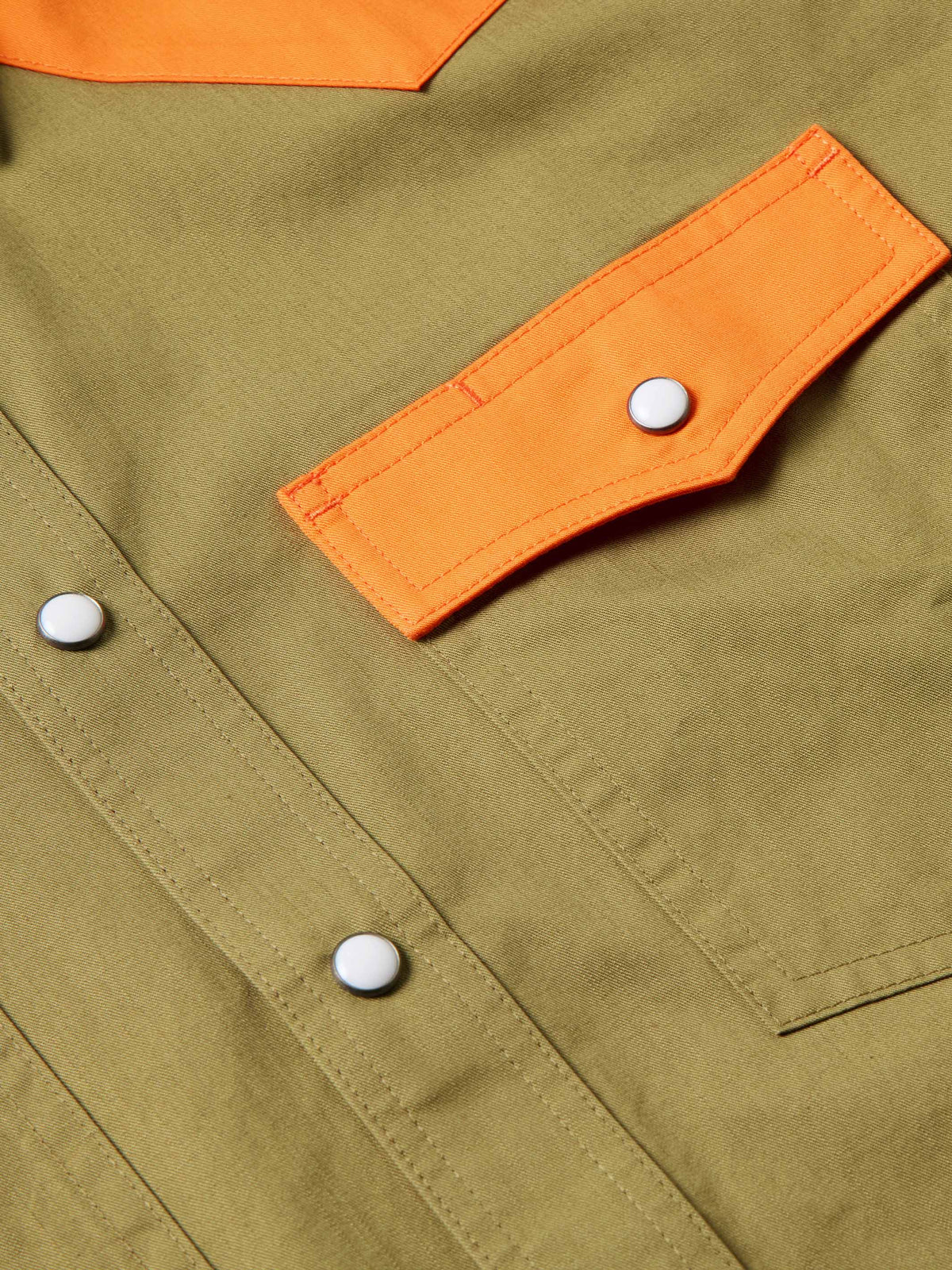 Olive shirt sleeve with orange tab and white snap buttons
