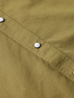 Olive slub twill placket with white snap buttons and visible stitching