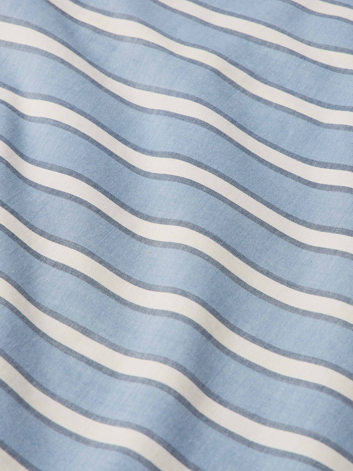 Blue and white striped fabric view of a short-sleeve pearl snap shirt