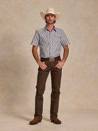 Blue-and-white striped short-sleeve pearl snap shirt worn with brown pants