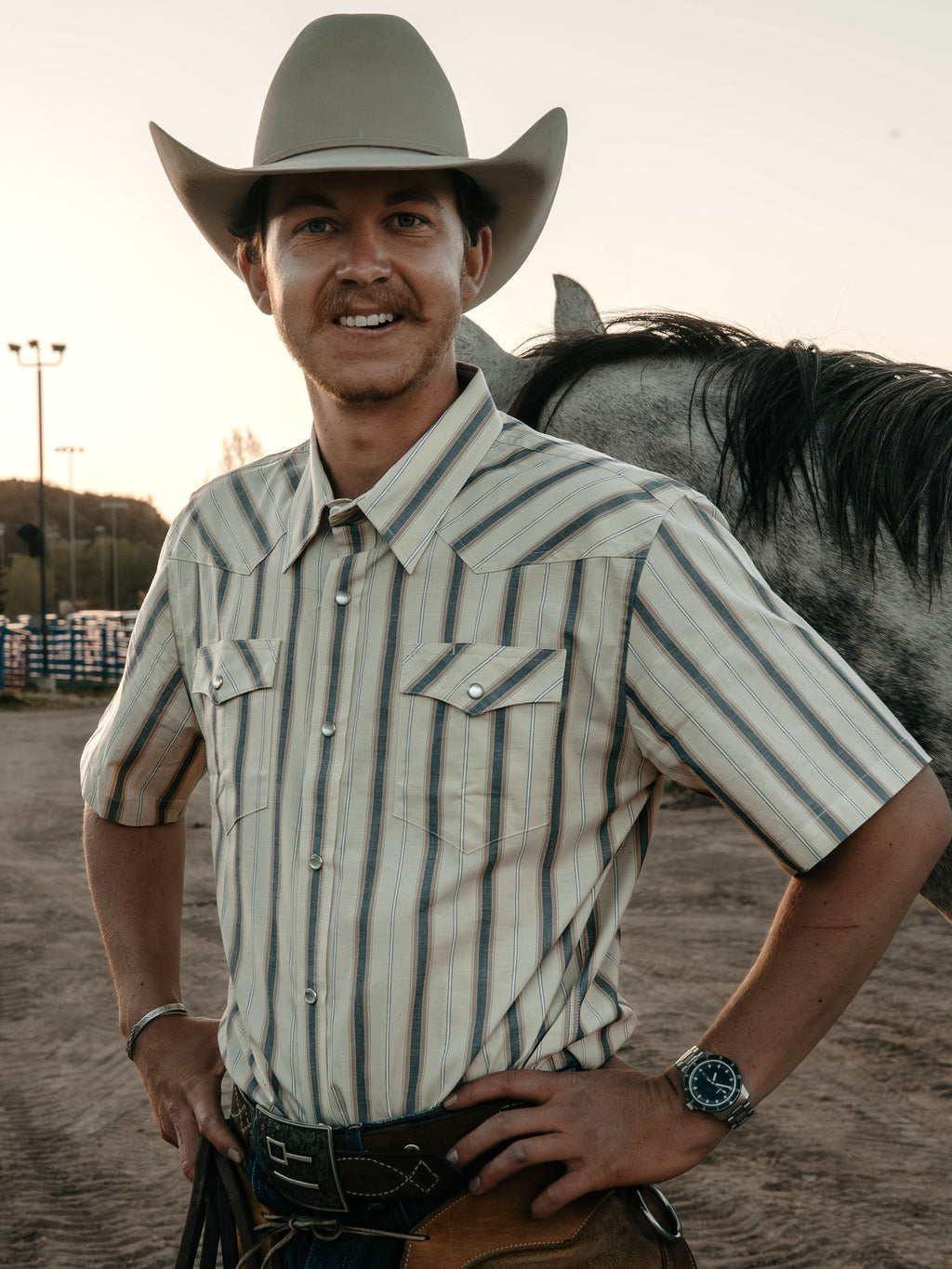 Men's short-sleeve pearl snap shirt, light striped cotton with button placket and pockets