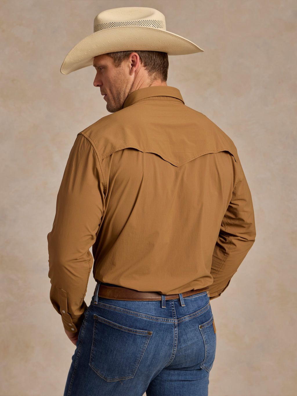 Pecan western snap shirt worn by model with long sleeves and yoke back