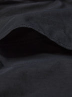 Black western snap shirt close-up of curved hem and soft fabric drape