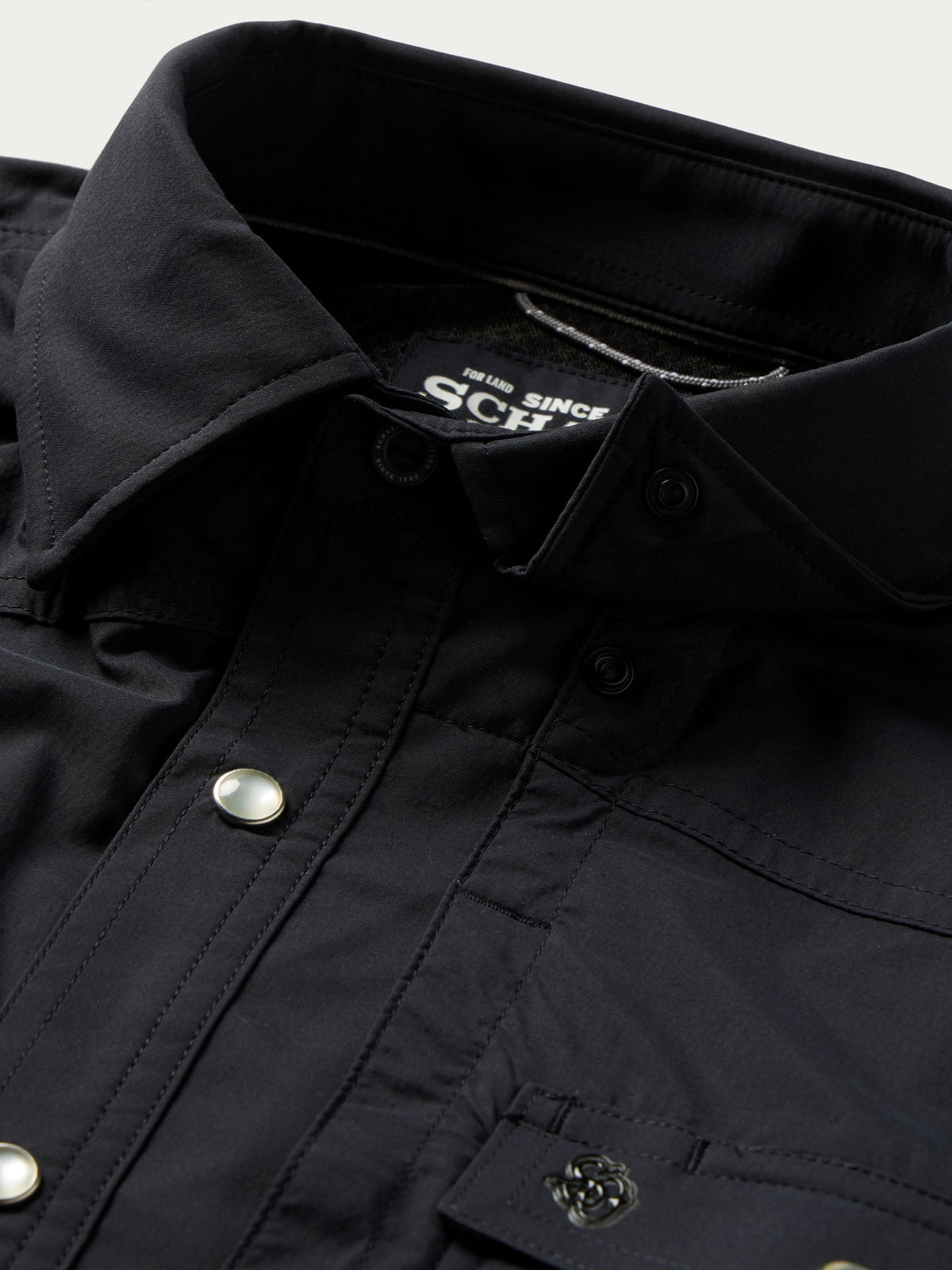 Black western snap shirt close-up of inside collar label and snap placket