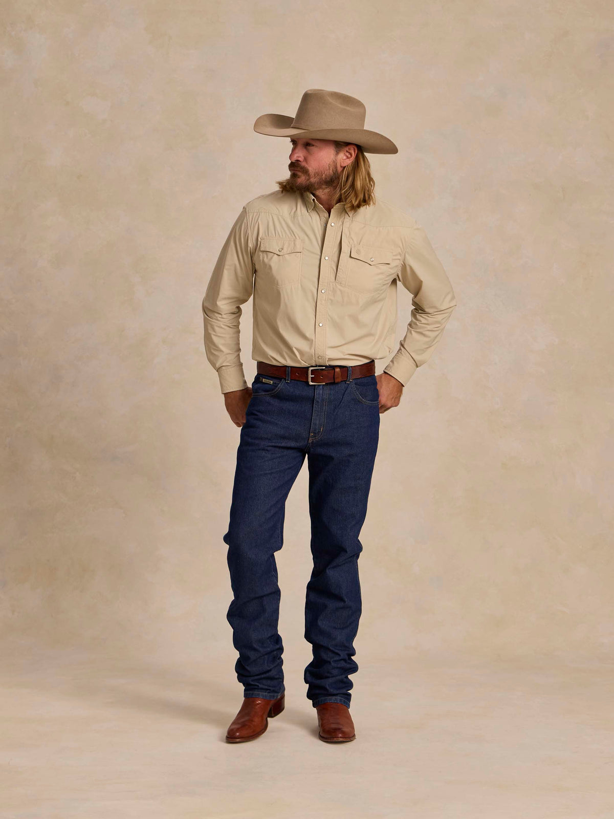 Khaki western snap shirt with collar and chest pocket on front.