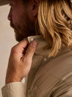 Khaki western snap shirt collar and placket detail with snap closure and metal buttons