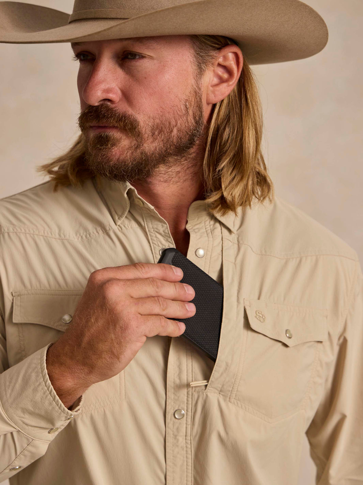 Khaki western snap shirt collar with metal snaps and chest pocket.