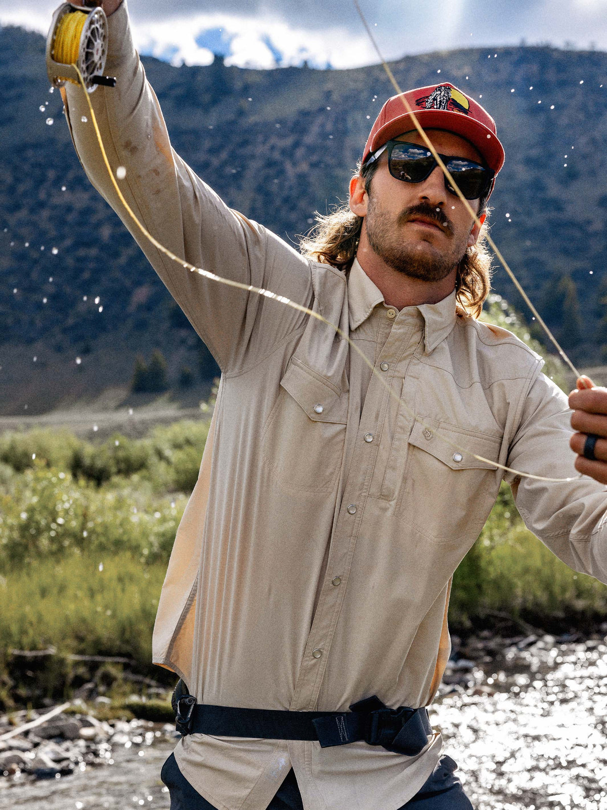 Khaki western snap shirt with chest pockets and snap-button front.
