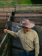 Olive western snap shirt worn with long sleeves and front button placket