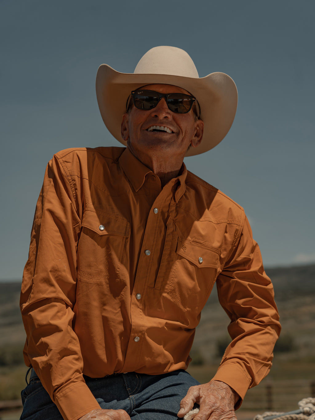 Men's rust western snap shirt with button-down front and chest pockets