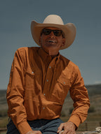 Men's rust western snap shirt with button-down front and chest pockets