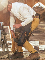 White snap-front western guide shirt worn outdoors with long sleeves and chest pockets