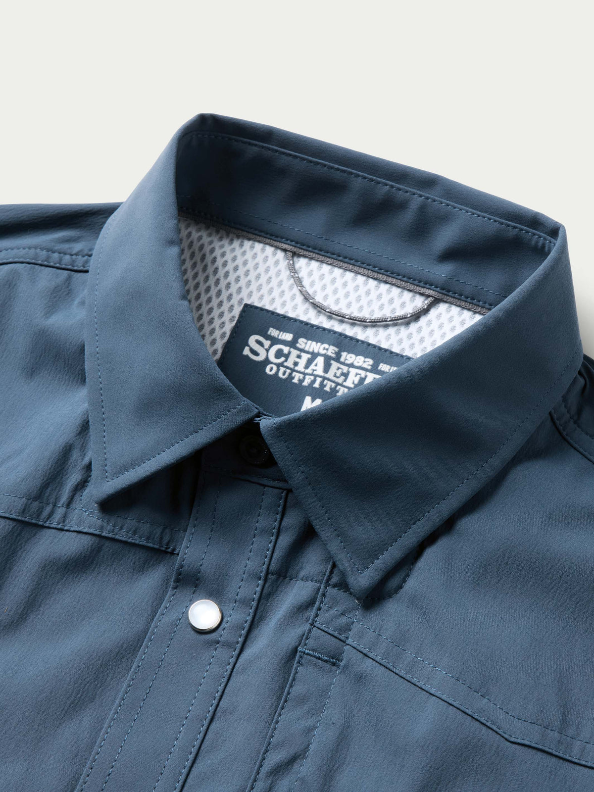 Navy western snap shirt with inner neck label and button-front details