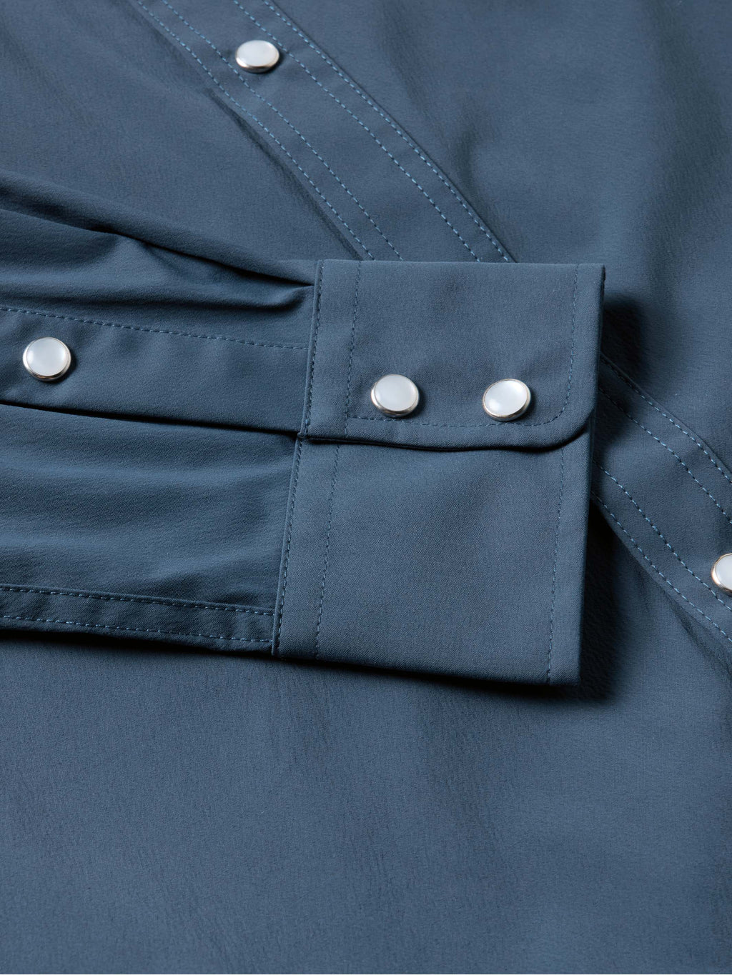 Navy shirt front with flap pocket and silver snap buttons