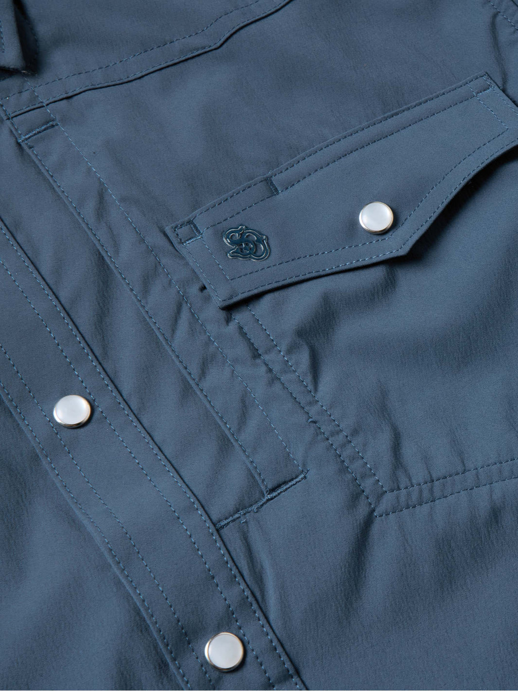 Navy western snap shirt with stitched detailing and silver snap at chest