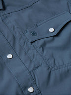 Navy western snap shirt with stitched detailing and silver snap at chest