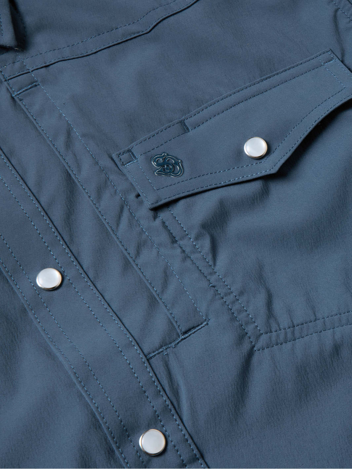 Navy western snap shirt with stitched detailing and silver snap at chest
