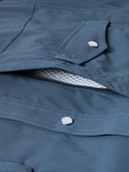 Navy snap pocket shirt with hidden zipper and flap closure