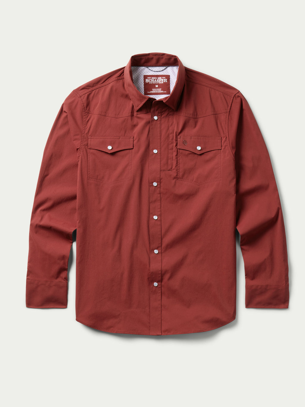 Oxblood western snap shirt with two chest pockets and long sleeves