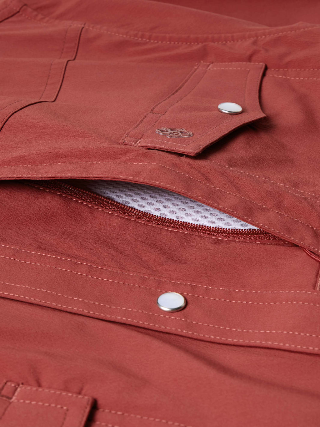 Oxblood snap pocket with open flap and contrast mesh lining at placket