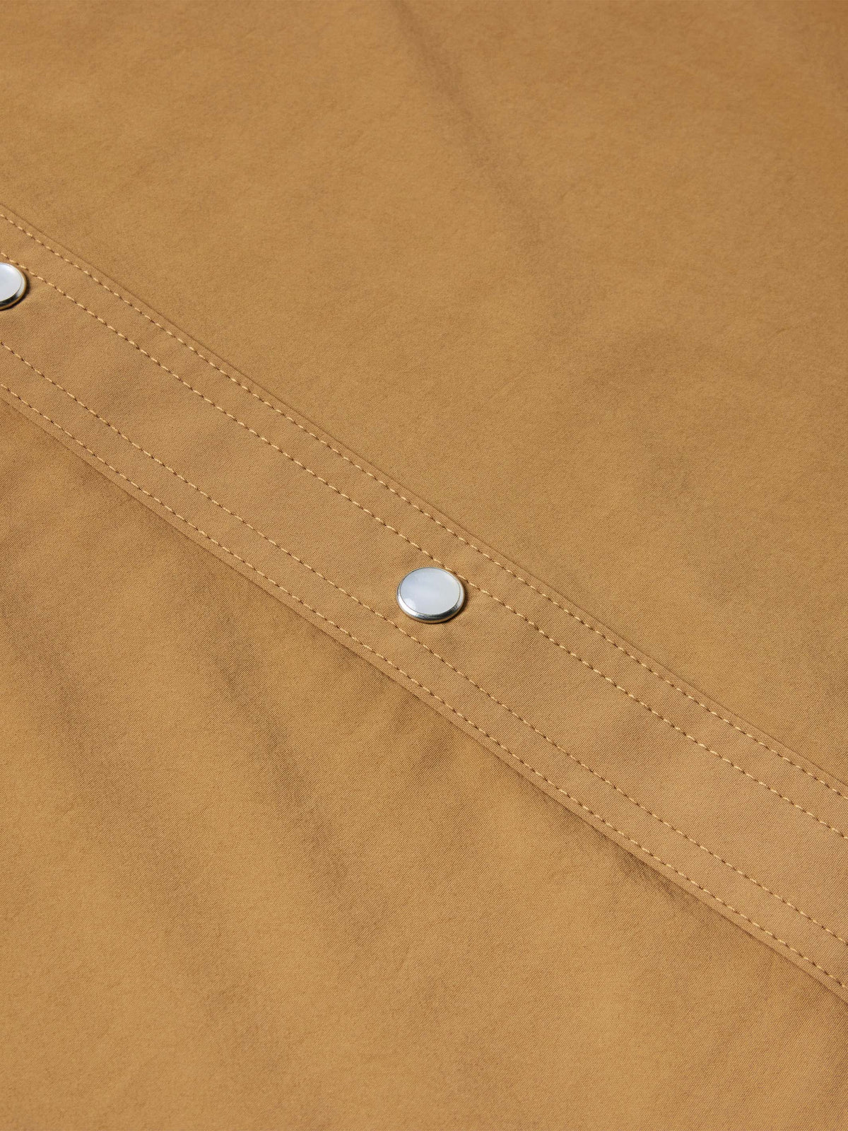 Pecan western snap shirt close-up of diagonal stitched panel with metal snaps