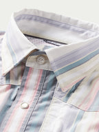 Collar and placket close-up of pastel striped western snap shirt with snap button
