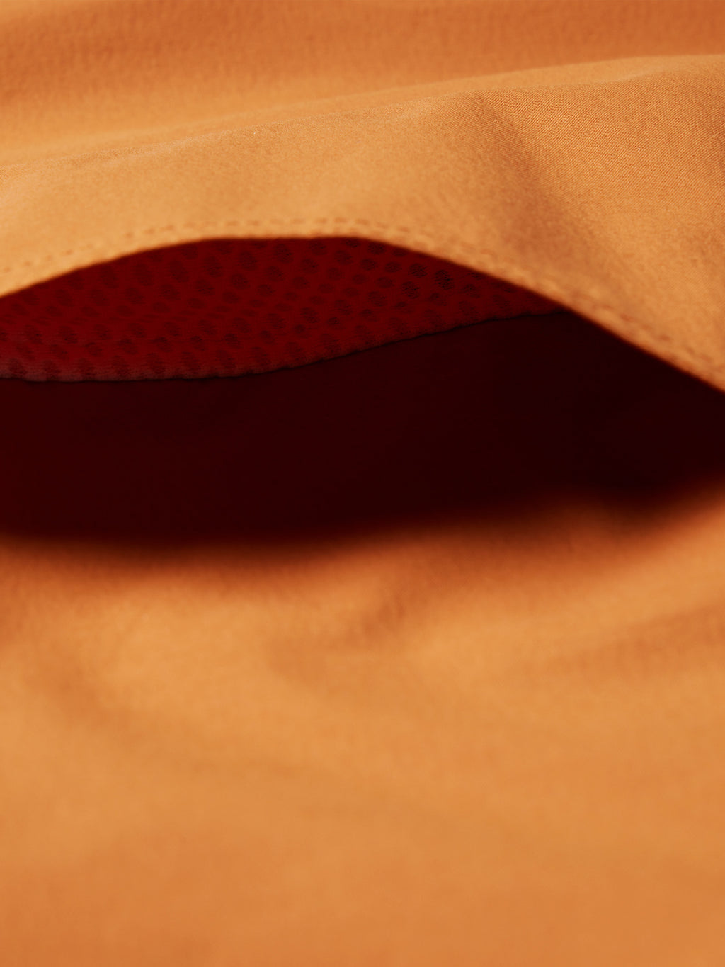 Rust snap shirt with dark patterned lining detail
