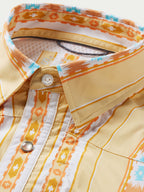 Western snap shirt collar and placket with cream fabric, orange trim, and Aztec pattern