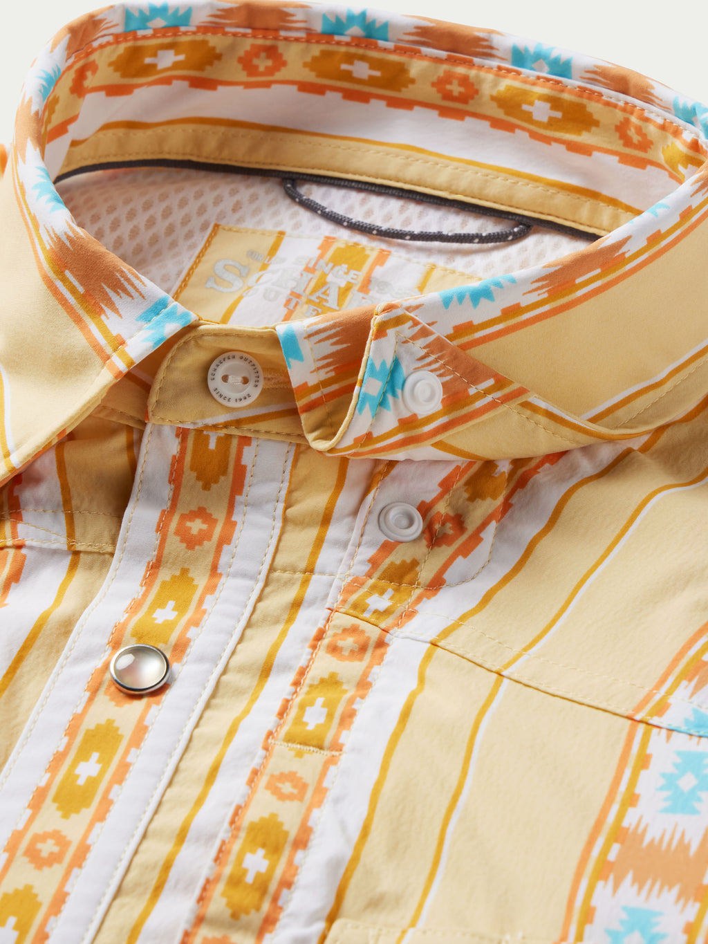 Western snap shirt chest with snap buttons, cream base, and orange and blue striped pattern