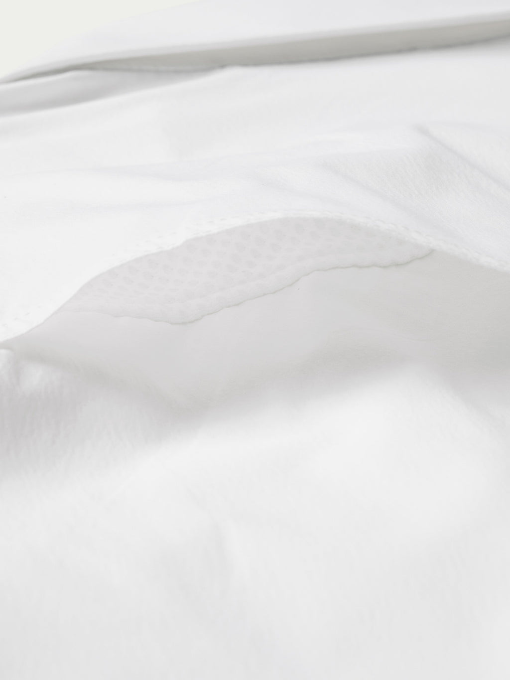 White western snap shirt fabric texture with stitched curved seam close-up