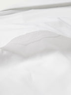 White western snap shirt fabric texture with stitched curved seam close-up