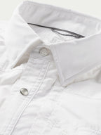 White western snap shirt chest placket with snap button and top-stitching close-up