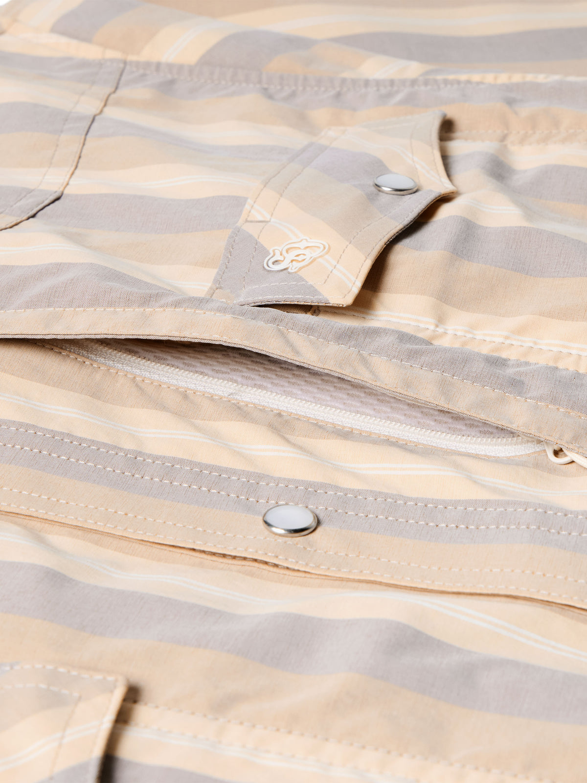 Striped western snap shirt with curved yoke and metal snap placket, logo detail