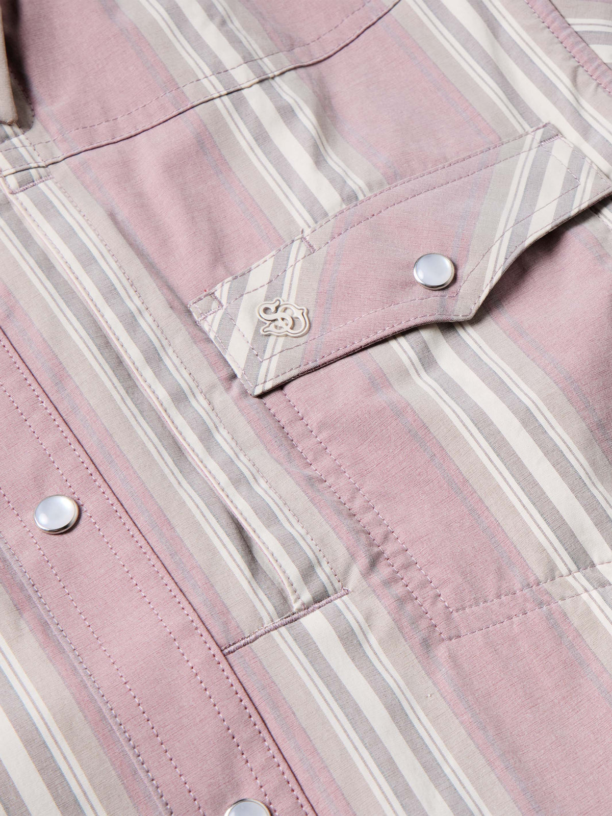 Pink striped shirt yoke and snap buttons with decorative trim