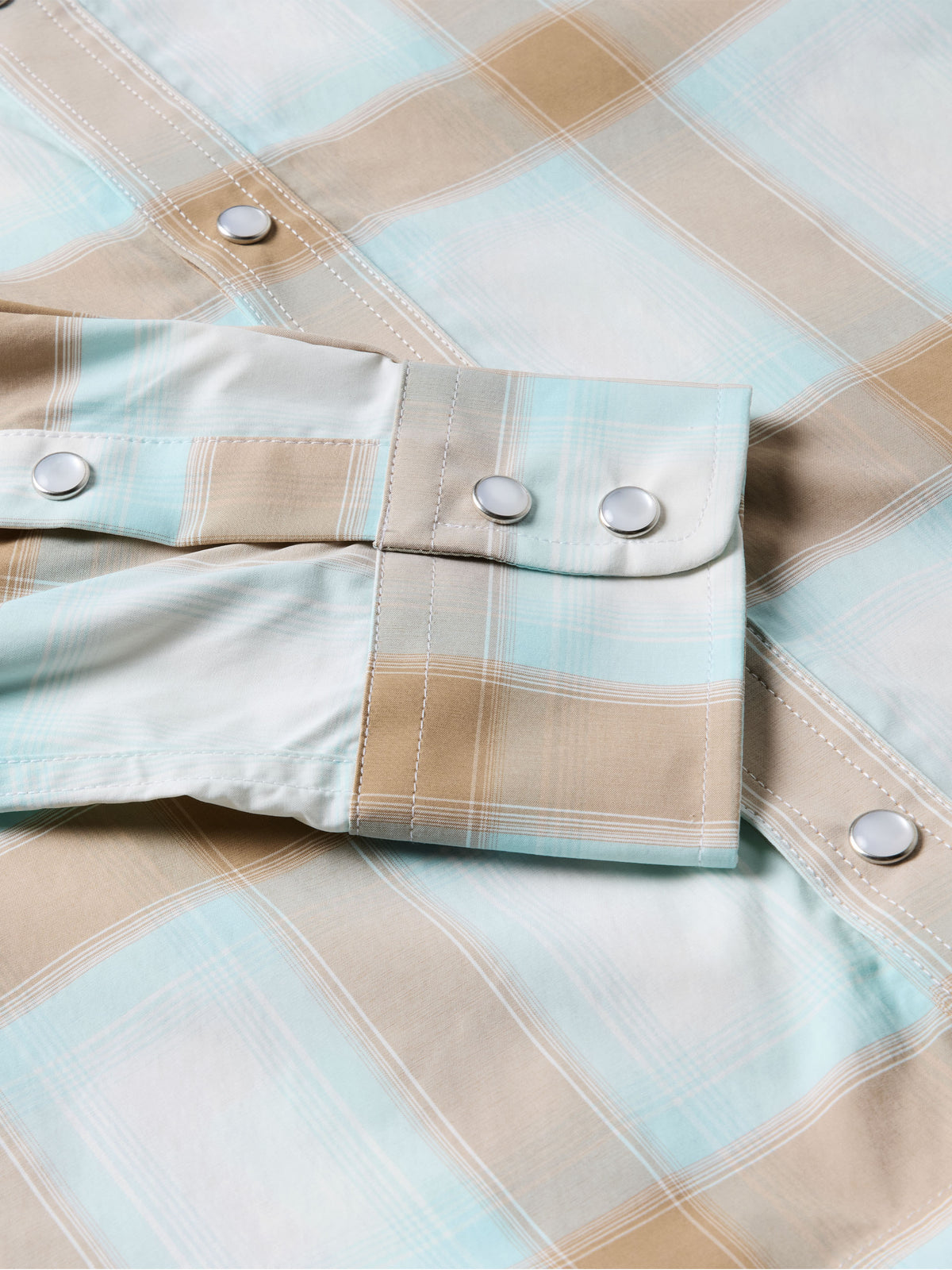 Western snap shirt in light blue and tan plaid, with snap cuffs and buttons
