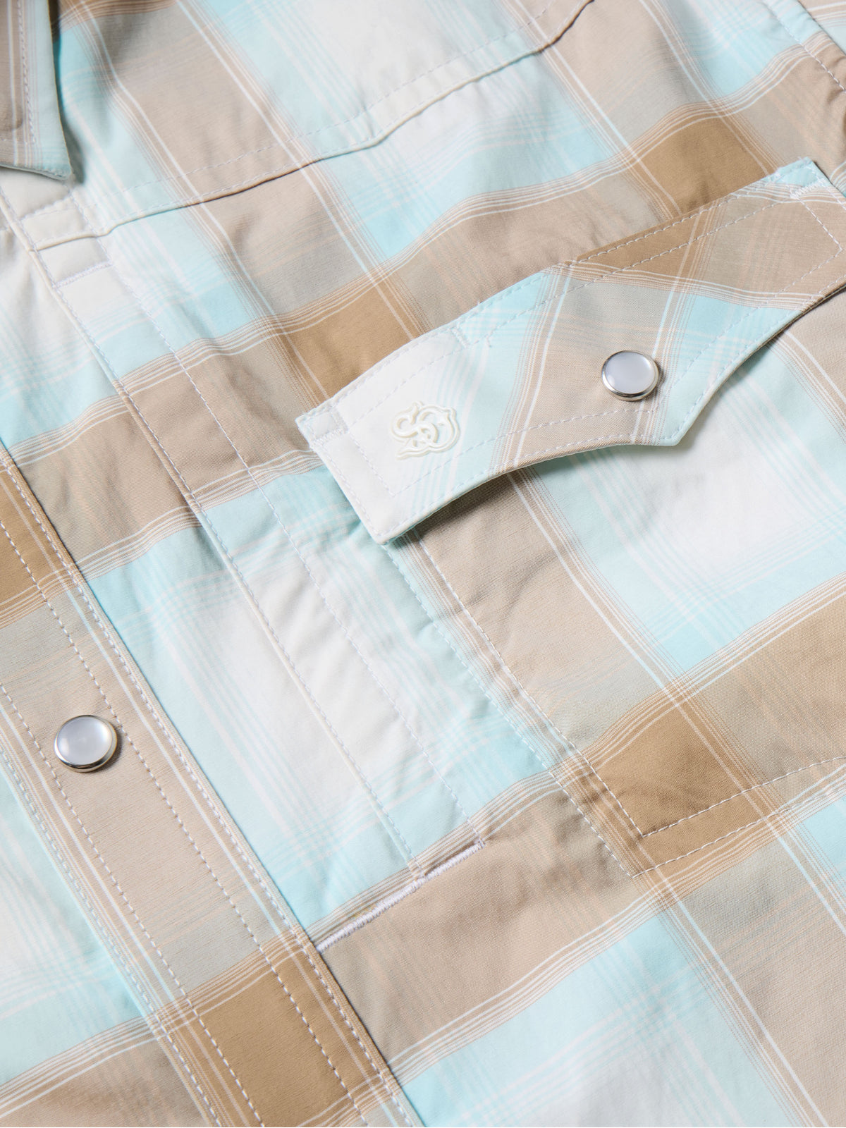 Western snap shirt with light blue and tan plaid, buttoned sleeve placket detail