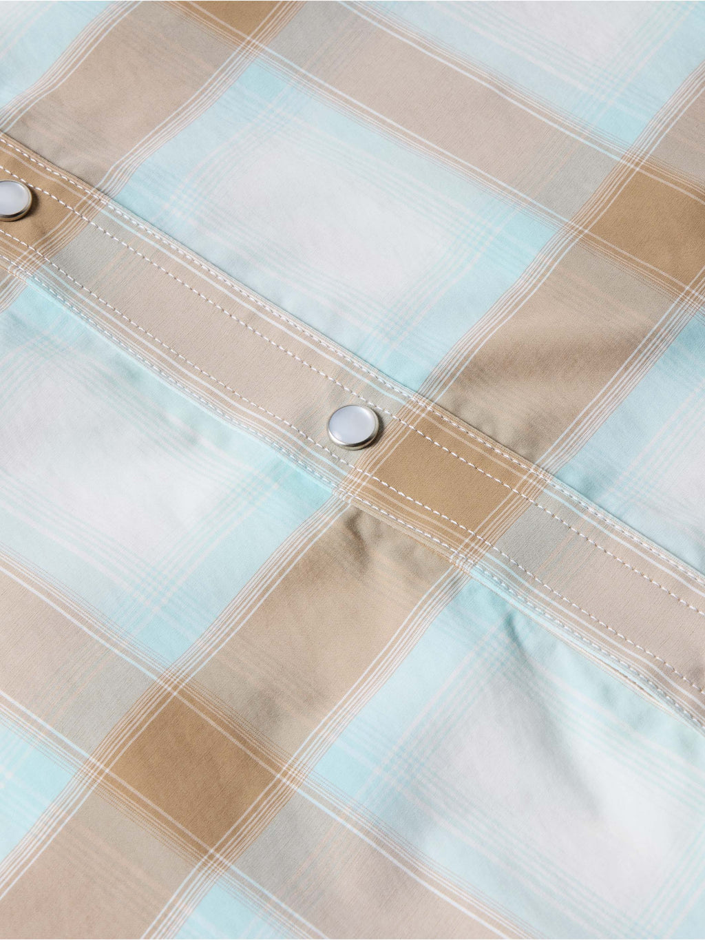 Western snap shirt in light blue and tan plaid, chest button and stitched placket