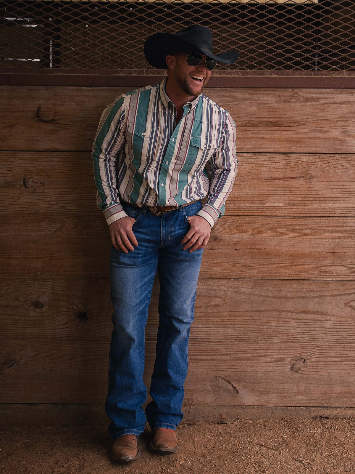Western snap shirt in striped fabric with teal yoke panel, worn with jeans