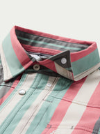 Western snap shirt collar and front placket with snaps on striped fabric.