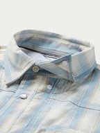 Light blue and white plaid snap-front western shirt, buttoned collar and yoke detail