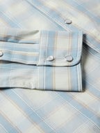 RangeTek shirt detail, light blue plaid pocket flap with metal snap buttons